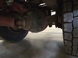 a close up view of a truck ' s tire on the ground