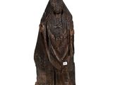 an old wooden statue of a man with a beard and a robe