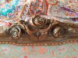 three roses that are sitting on top of a bed