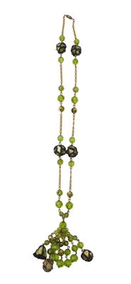 green and black beaded necklace on a white background