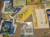 a table with a lot of stamps and postcards on it