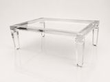 a clear glass coffee table with clear legs and a clear glass top