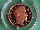 a close up of a coin in a clear holder on a green surface