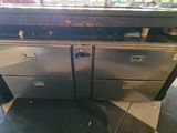 a silver oven sitting on top of a counter in a store