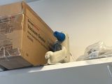 a box sitting on top of a shelf in a room