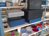 many containers and containers on a shelf in a store