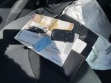 a car seat with a book and remote control on top of it