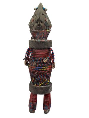 a statue of a man made out of wood and beads
