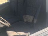 the interior of a car with two seats and a steering wheel