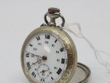 a silver pocket watch with roman numerals on it