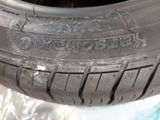 a close up of a tire on a piece of plastic