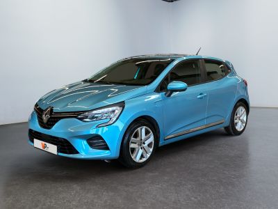 a blue car parked in a room with a clock on the wall