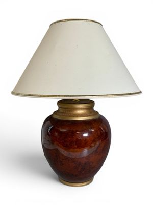 a lamp that has a white shade on it