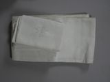 a stack of folded napkins sitting on a table