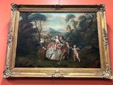 peinture sur le mur d'un musée représentant une femme et deux enfants