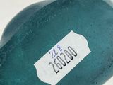 a close up of a bottle with a sticker on it