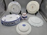 four plates and a bowl on the table