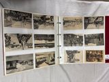 an old photo of a bunch of old photos on a table