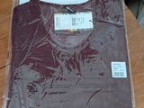 a shirt that is sitting on a table in the room