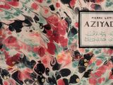 a picture of a floral shirt with a name tag on it