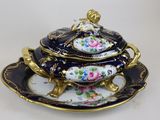 an image of a fancy blue and gold covered dish