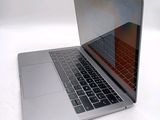 a close up of a laptop computer on a white surface