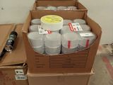 a carton full of cans and a bottle of water on a pallet