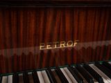 a close up of a piano with a name on it