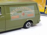 a green toy van that is sitting on a table