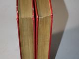 two books stacked on top of each other on a table