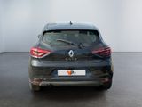 the rear view of a black car parked in a white room