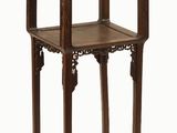 a small wooden table with a shelf on top of it