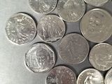a lot of coins that are on the table