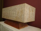 a stone block with carvings on it in a museum