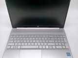 an open laptop computer sitting on top of a white table