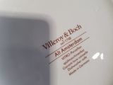 a close up of a plate with a name on it