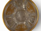 a close up of a glass bowl on a white surface