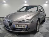 a picture of a silver car parked in a garage
