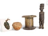 a small statue of a man standing next to other items