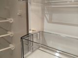 an image of an empty refrigerator with the door open