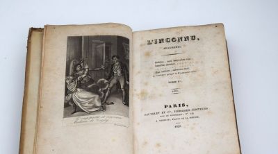 un vieux livre avec l'image d'un homme et d'une femme