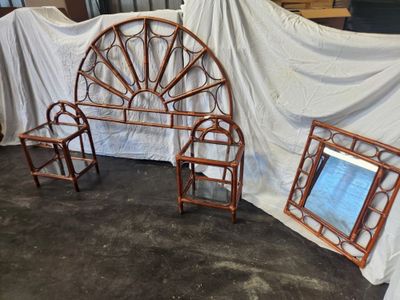 two chairs and a table in front of a white sheet