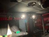 a stage set up for a show with a red curtain