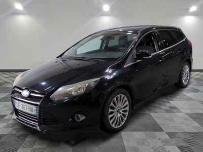 a picture of a black ford focus parked in a garage