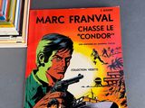 a picture of a comic book with a picture of a man holding a gun