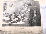 un vieux livre sur lequel figure l'image d'un homme assis à une table