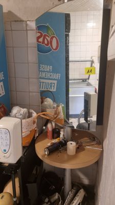 an image of a small kitchen with a microwave and toaster on a table