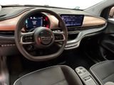 the interior of a car with a steering wheel, dashboard, and display screen