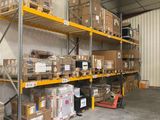 many boxes on the shelves in the warehouse