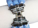 a close up of a bracelet with blue beads on it